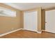 This bedroom has a closet with white doors and hardwood flooring at 6338 S Oneida Ct, Centennial, CO 80111