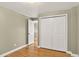 This bedroom has hardwood floors and a large closet with white doors at 6338 S Oneida Ct, Centennial, CO 80111