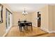 Traditional dining room with hardwood floors and classic chandelier at 6338 S Oneida Ct, Centennial, CO 80111