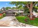 Charming two-story home with a well-manicured front yard and a spacious two-car garage at 6338 S Oneida Ct, Centennial, CO 80111