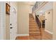 Inviting entryway with hardwood floors leading to the staircase and second level at 6338 S Oneida Ct, Centennial, CO 80111