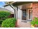 Inviting front porch with brick accents, providing a warm welcome to the home at 6338 S Oneida Ct, Centennial, CO 80111