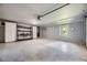 Clean and organized garage with epoxy floor, built-in storage, and ample space at 6338 S Oneida Ct, Centennial, CO 80111