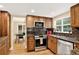 Stylish kitchen with stainless steel appliances, granite countertops, and wooden cabinets at 6338 S Oneida Ct, Centennial, CO 80111