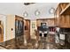 Modern kitchen with stainless steel appliances, granite countertops, and stylish pendant lighting at 6338 S Oneida Ct, Centennial, CO 80111