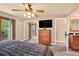 Bright main bedroom featuring a closet, deck access, and an en-suite bathroom at 6338 S Oneida Ct, Centennial, CO 80111