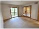 Open bedroom area with a balcony, natural light, and double doors to secondary room at 2802 Sundown Ln # 103, Boulder, CO 80303