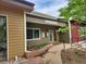 Exterior shot of the clubhouse featuring lush landscaping, ample parking, and a welcoming entrance at 2802 Sundown Ln # 103, Boulder, CO 80303