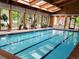 Bright indoor pool with wooden ceiling, skylights, and large windows bringing the outside in at 2802 Sundown Ln # 103, Boulder, CO 80303