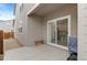 Back patio with a sliding glass door and space for outdoor seating and grilling at 23820 E 34Th Ave, Aurora, CO 80019