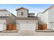 Charming home exterior featuring a two-car garage, neutral siding, and neatly landscaped front yard at 23820 E 34Th Ave, Aurora, CO 80019