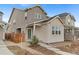 Inviting home exterior with stone accents, landscaped yard, and charming curb appeal at 23820 E 34Th Ave, Aurora, CO 80019