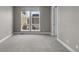 Light-filled bedroom with neutral walls, carpet, and bright white trim at 11918 Mountview Ln, Broomfield, CO 80021