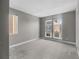 Bright bedroom with neutral gray walls, carpet, and large windows at 11918 Mountview Ln, Broomfield, CO 80021