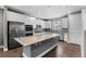 Gourmet kitchen boasts a spacious island, stainless appliances, and ample cabinet space at 11918 Mountview Ln, Broomfield, CO 80021