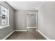 A living room with light gray walls, hardwood flooring, and a large window at 11918 Mountview Ln, Broomfield, CO 80021