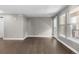 Bright and airy living room features hardwood floors and large windows at 11918 Mountview Ln, Broomfield, CO 80021