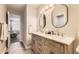 Bathroom featuring a double sink vanity, modern fixtures, and tile flooring at 8862 Chestnut Hill Ln, Highlands Ranch, CO 80130