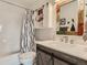 Bathroom with vanity and modern mirror with storage cabinet at 8862 Chestnut Hill Ln, Highlands Ranch, CO 80130