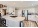 Contemporary kitchen features a large island, stainless steel appliances, and modern lighting fixtures at 8862 Chestnut Hill Ln, Highlands Ranch, CO 80130