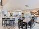 Spacious open-concept kitchen and dining area with modern appliances and stylish decor at 8862 Chestnut Hill Ln, Highlands Ranch, CO 80130