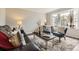 Cozy living room featuring plush seating, stylish decor, and a bright bay window with natural light at 8862 Chestnut Hill Ln, Highlands Ranch, CO 80130