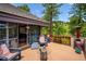 Open deck with wood floors, outdoor seating and picturesque views of the landscaped backyard at 33208 Alta Vista Dr, Evergreen, CO 80439