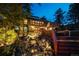 Exterior of home shows stone waterfall feature, wood decks and stairway at 33208 Alta Vista Dr, Evergreen, CO 80439