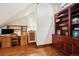 Home office with built-in bookcase and wood floors at 33208 Alta Vista Dr, Evergreen, CO 80439