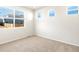 Comfortable bedroom features carpet, three windows providing lots of natural light, and a peaceful atmosphere at 6050 Hourglass Dr, Brighton, CO 80601