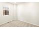 Simple bedroom with neutral walls, carpeted floor, and window with blinds at 6050 Hourglass Dr, Brighton, CO 80601