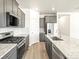 Spacious kitchen with stainless steel appliances and granite countertops at 6050 Hourglass Dr, Brighton, CO 80601