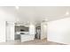 Open concept kitchen with island and stainless steel appliances at 6050 Hourglass Dr, Brighton, CO 80601