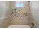 Updated bathroom featuring modern tile work, stylish fixtures, and bright lighting at 3444 Lawrence St, Denver, CO 80205