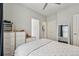 Bright bedroom with a neutral color palette, filled with natural light from nearby windows at 3444 Lawrence St, Denver, CO 80205