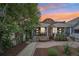 Charming brick home with a well-manicured front yard and a cozy front porch at 3444 Lawrence St, Denver, CO 80205