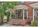 Charming brick home with a covered front porch perfect for enjoying the outdoors at 3444 Lawrence St, Denver, CO 80205