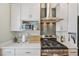 Updated kitchen with stainless steel appliances, gas range and quartz countertops at 3444 Lawrence St, Denver, CO 80205