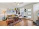 Cozy living room with hardwood floors, stylish decor, and a comfortable seating area at 3444 Lawrence St, Denver, CO 80205