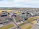 Aerial view of a neighborhood featuring homes with solar panels and fenced yards at 8230 S White Crow St, Aurora, CO 80016