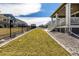 Large backyard with well-maintained lawn, gravel beds and black metal fence at 8230 S White Crow St, Aurora, CO 80016