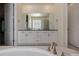Lovely bathroom featuring dual sinks, white cabinets, soaking tub, walk-in shower and walk-in closet access at 8230 S White Crow St, Aurora, CO 80016