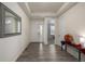 Bright entryway with wood floors, neutral paint and views to other areas of the home at 8230 S White Crow St, Aurora, CO 80016