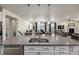 Spacious kitchen island overlooks the living room with fireplace and tv at 8230 S White Crow St, Aurora, CO 80016