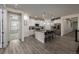 Bright, modern kitchen with white cabinets, stainless appliances, and island seating at 8230 S White Crow St, Aurora, CO 80016