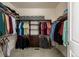 Well-organized walk-in closet with ample shelving and hanging space, perfect for storage and organization at 8230 S White Crow St, Aurora, CO 80016