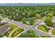 Neighborhood aerial view showcasing tree-lined streets, well-maintained homes, and proximity to green spaces at 5200 W Rowland Ave, Littleton, CO 80128