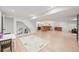 Spacious basement with hardwood floors, a bar area, and a play area for children at 5200 W Rowland Ave, Littleton, CO 80128