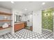 Bathroom showcasing a double sink vanity, a glass-enclosed shower, and hexagon tile flooring at 5200 W Rowland Ave, Littleton, CO 80128