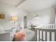 Bright, neutral bedroom with large window, stylish crib and comfortable rocking chair at 5200 W Rowland Ave, Littleton, CO 80128